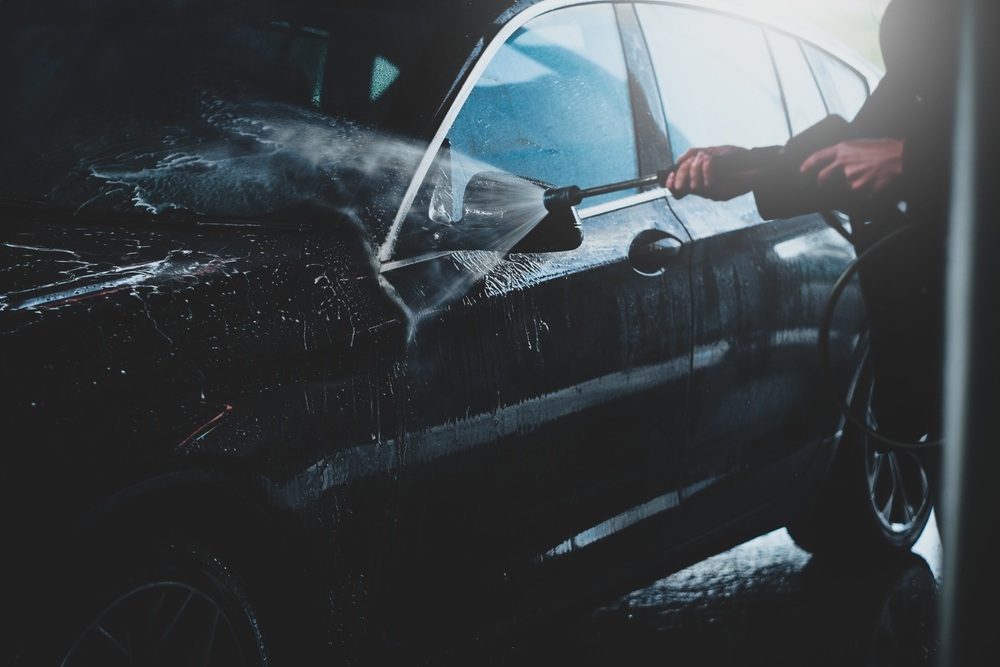 Exterior car wash in Hanford CA Vehicle being pressure washed during an exterior car cleaning service in Hanford, CA